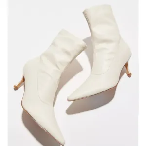 • urban outfitters creamy slim pointed toe faux leather boots •