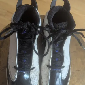 Black and White Sneakers with Blue Accents