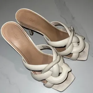 Cream leather kitten heel sandals from Coach